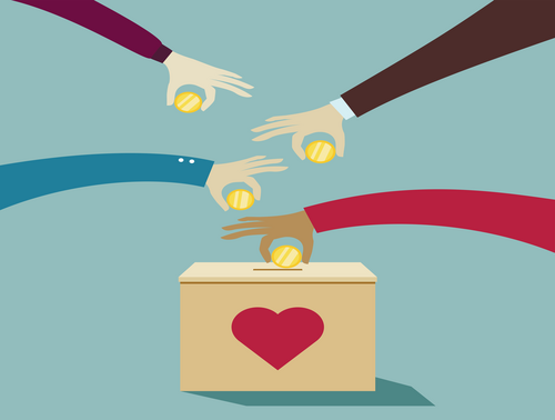 Hands placing money into a box.