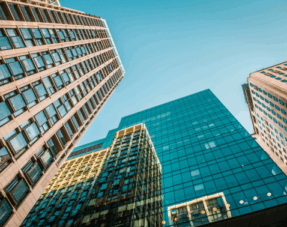 Photo of skyscrapers against a blue sky.