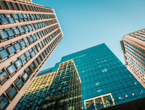 Photo of skyscrapers against a blue sky.
