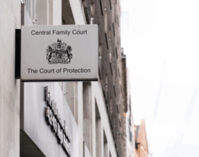 Sign for the Central Family Court and The Court of Protection mounted on the exterior of a building, representing family court hearings.