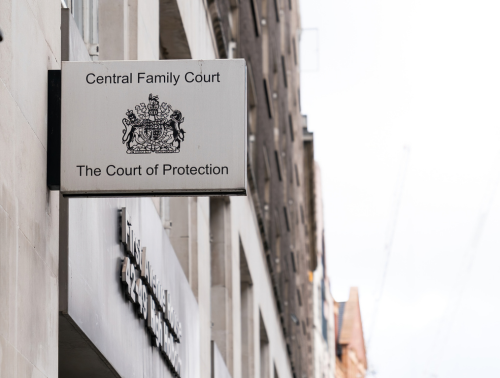 Sign for the Central Family Court and The Court of Protection mounted on the exterior of a building, representing family court hearings.