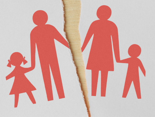 Silhouette of a family holding hands on a piece of paper torn in half down the middle, implying family disputes.