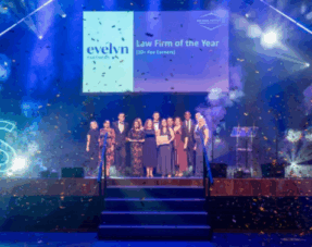 Image showing Howell Jones staff on stage winning Law Firm of the Year at the 2025 Surrey Law Society Awards.
