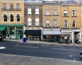 Photo of a street lined with commercial properties.